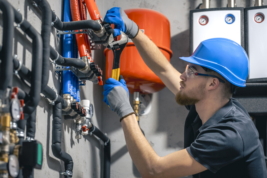 Plumber fixing pipes in Croatia